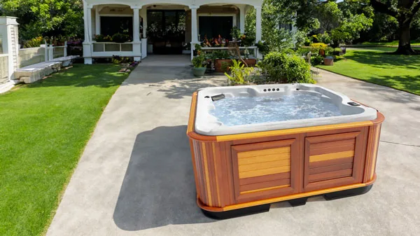 Arctic Spas Totem in a landscaped backyard setting