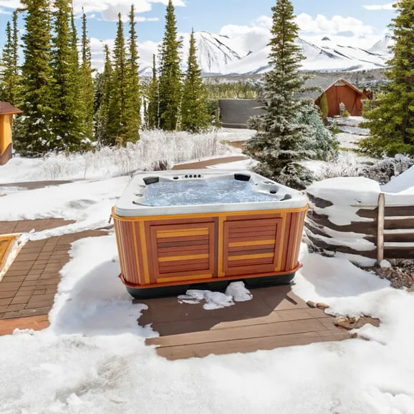 Arctic Spas Yukon hot tub with six-seat open layout on a wooden deck