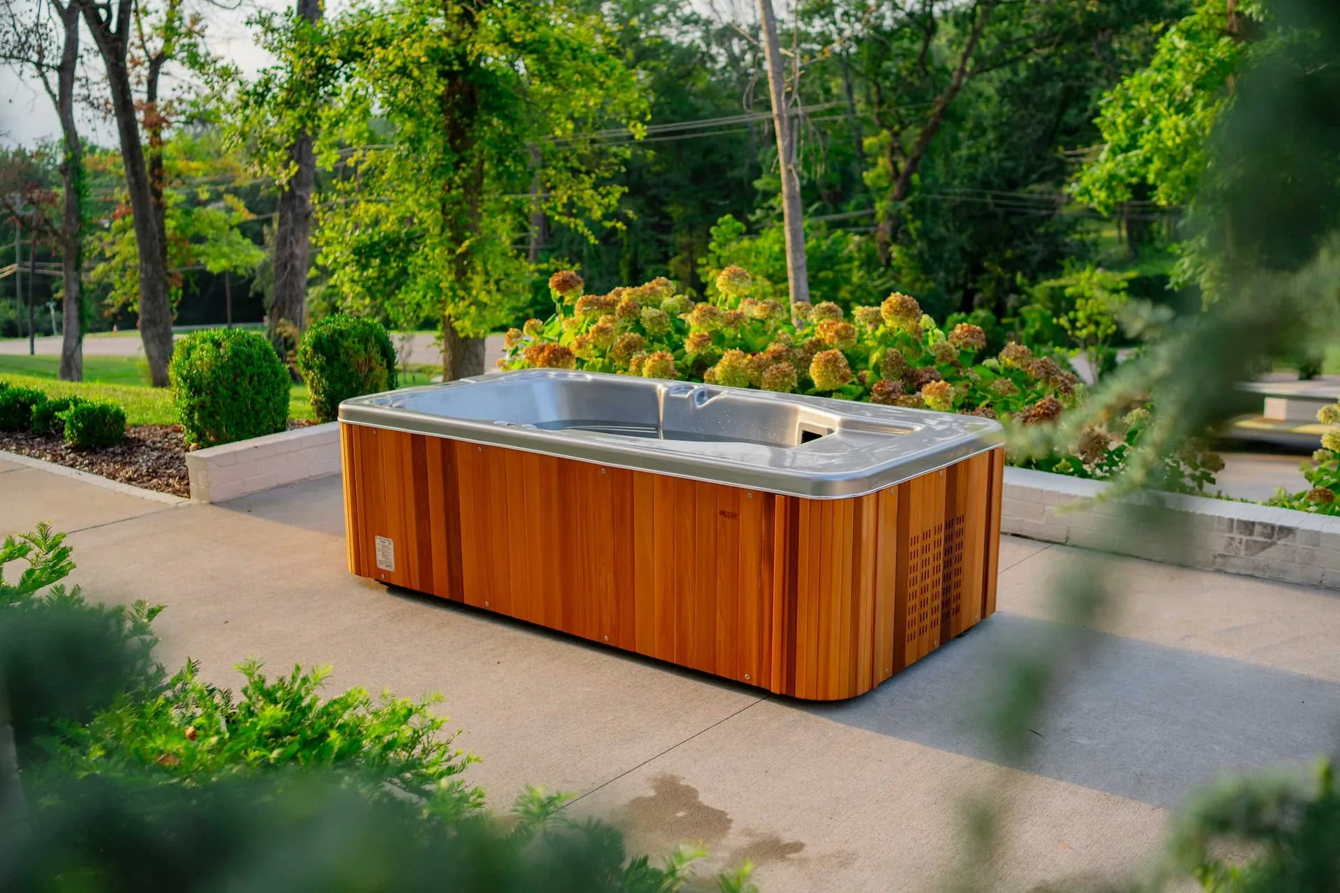 The Coldtub Plus lay-down cold immersion tub beside a modern pool