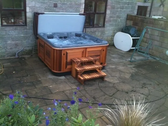 Premium hot tub on a timber deck at golden hour