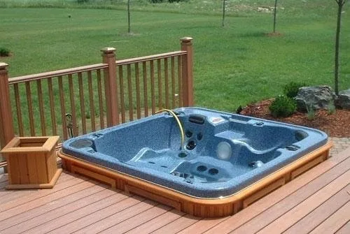 Newly installed hot tub on a paver patio in an Oakland Park backyard