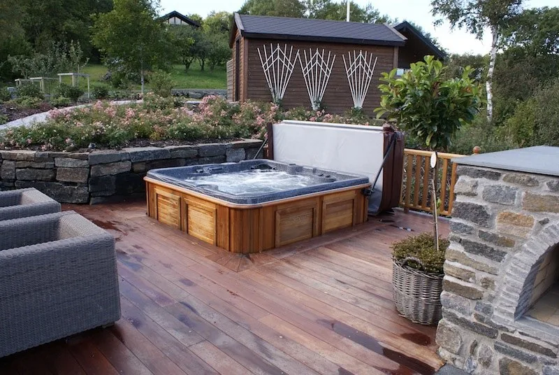 Technician connecting spa equipment during a hot tub setup in South Florida
